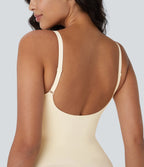Seamless sculpting bodysuit with second skin effect, adjustable straps, open back, flat stomach effect and push-up buttocks