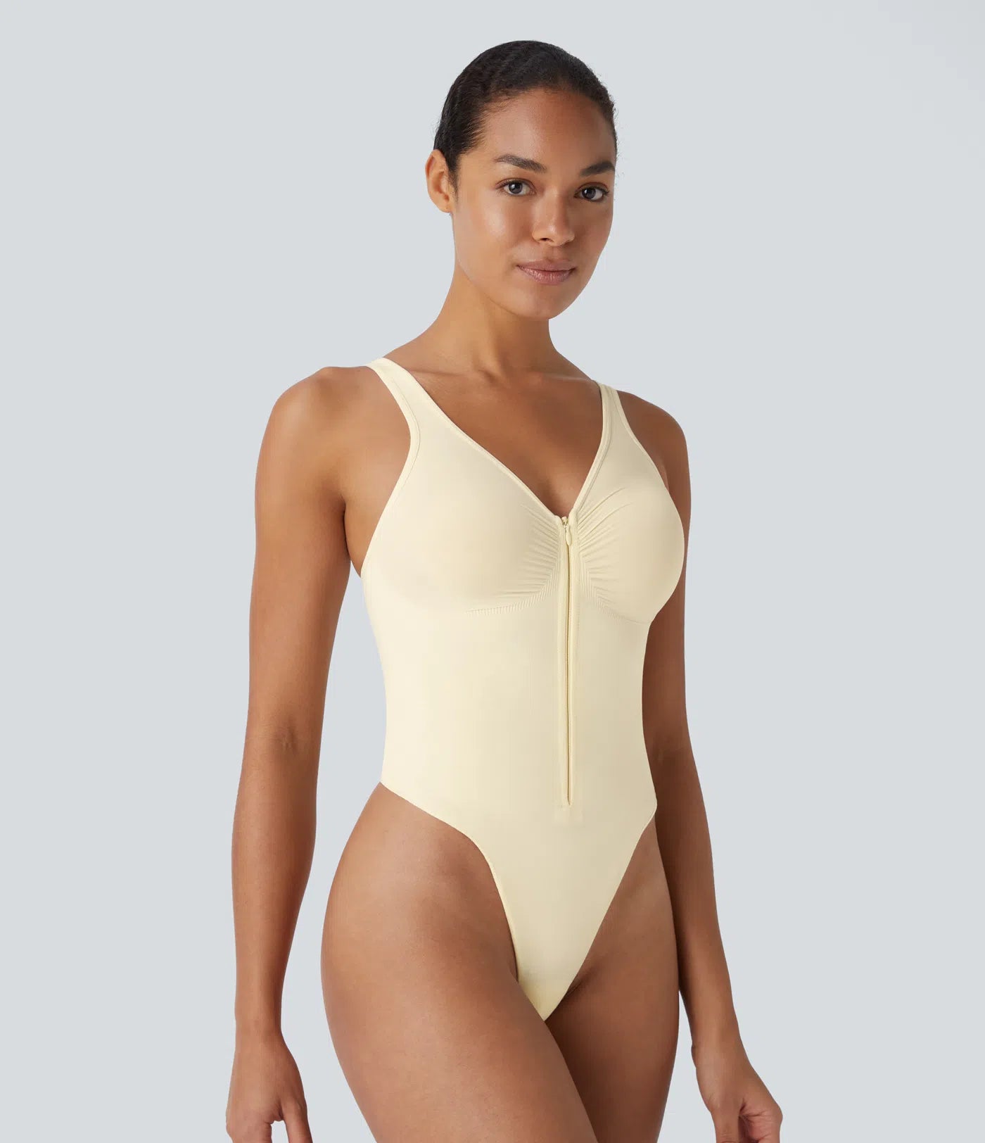 Flow seamless shaping bodysuit with adjustable straps and zip