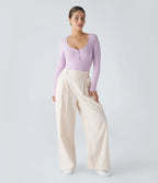 Uformell ribbestrikket body med Henley-hals, knapper og lange ermer