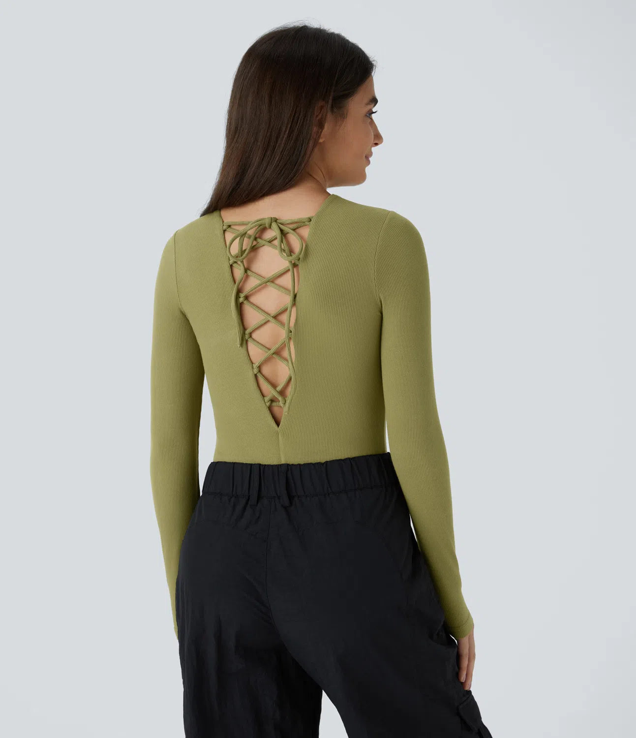Casual ribbed knit bodysuit with crisscross lacing and long sleeves